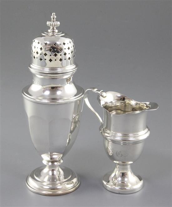 A late Victorian silver cream jug, by William Davenport and a sugar caster.